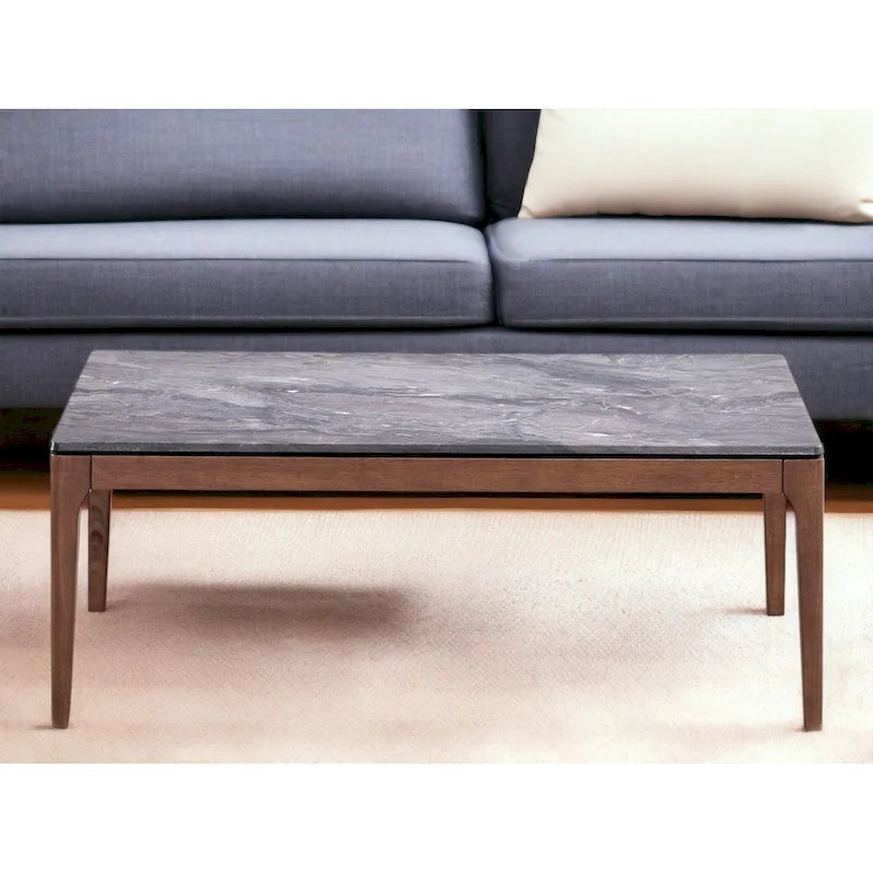 Table basse rectangulaire avec plateau en pierre grise et base en noyer massif
