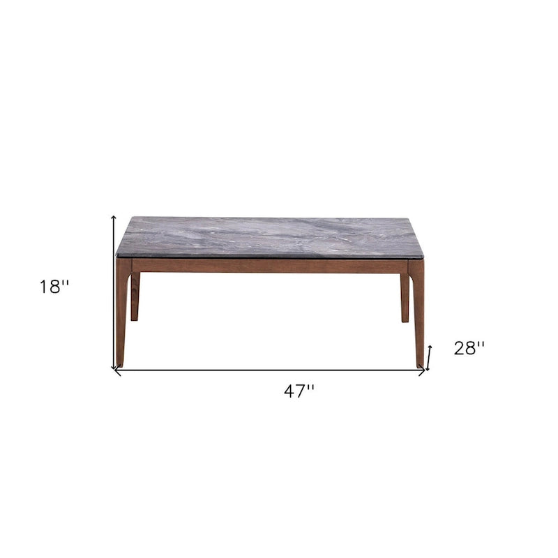 Table basse rectangulaire avec plateau en pierre grise et base en noyer massif