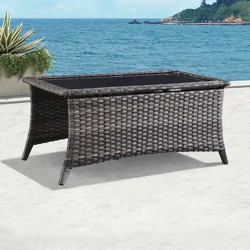 Table basse d'extérieur en rotin PE gris avec plateau en verre trempé et cadre en aluminium thermolaqué
